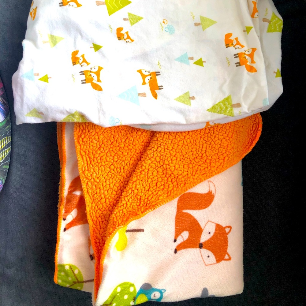 Baby blanket & crib sheet.